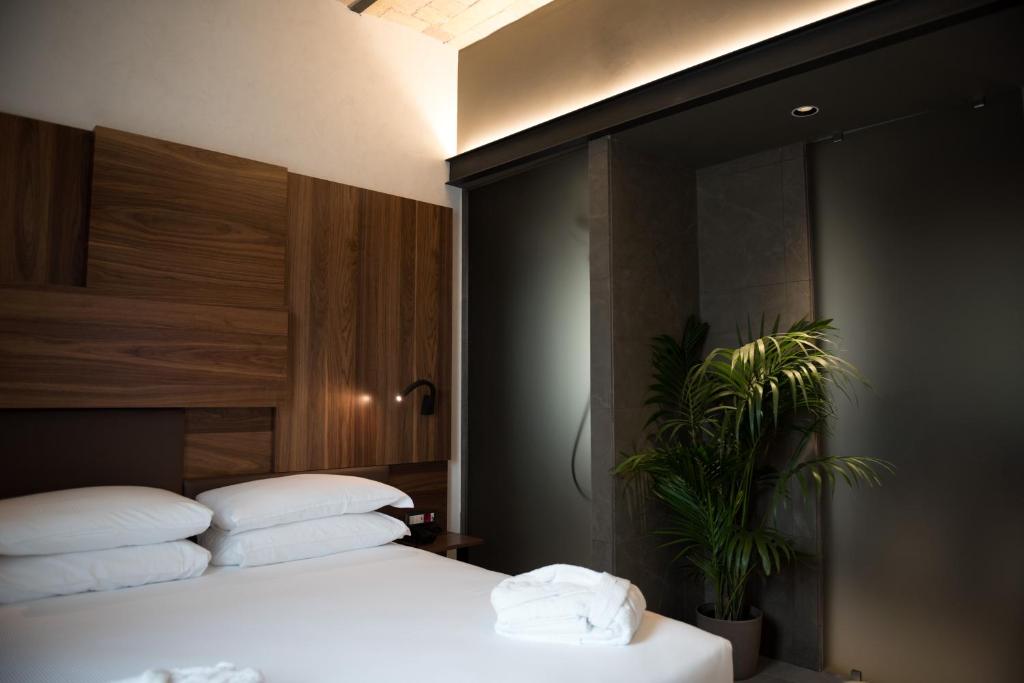Llit o llits en una habitació de Gasometer Urban Suites