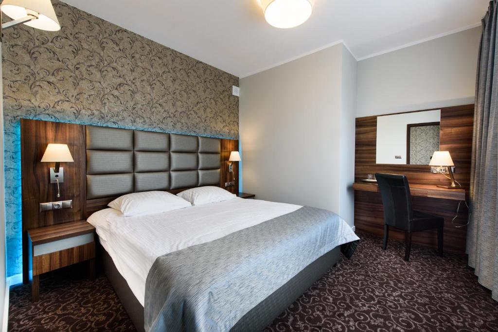 Posteľ alebo postele v izbe v ubytovaní Hotel Nowy Dwór