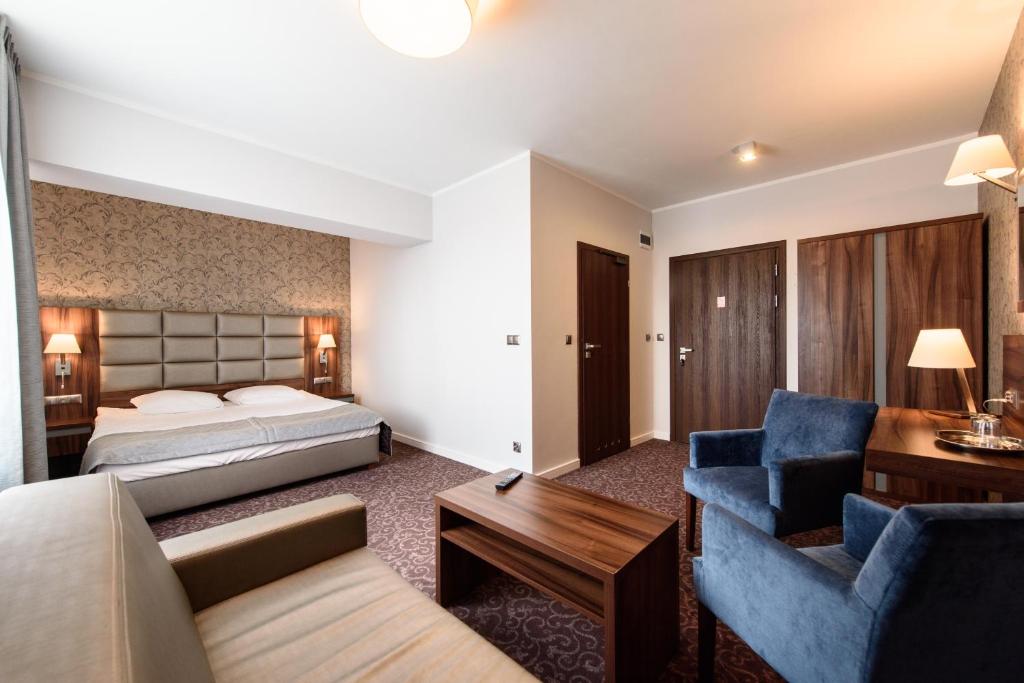 Posteľ alebo postele v izbe v ubytovaní Hotel Nowy Dwór