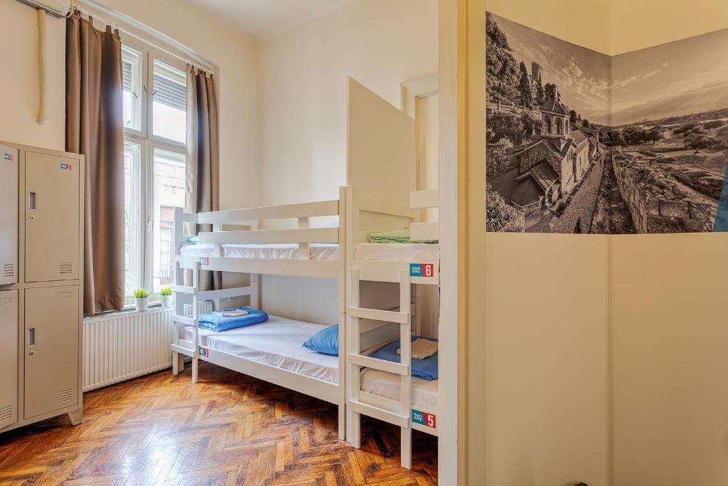Postel nebo postele na pokoji v ubytování Booking BnB