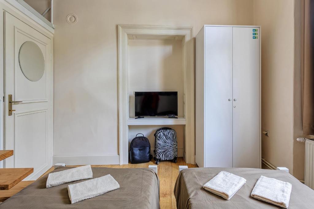 Postel nebo postele na pokoji v ubytování Booking BnB