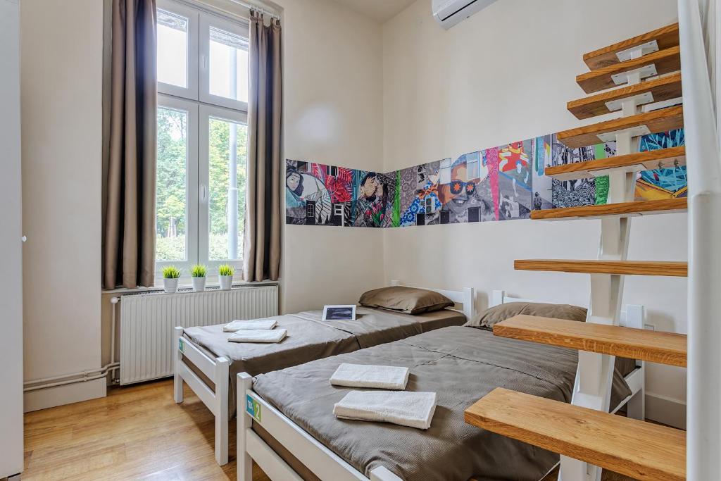 Postel nebo postele na pokoji v ubytování Booking BnB