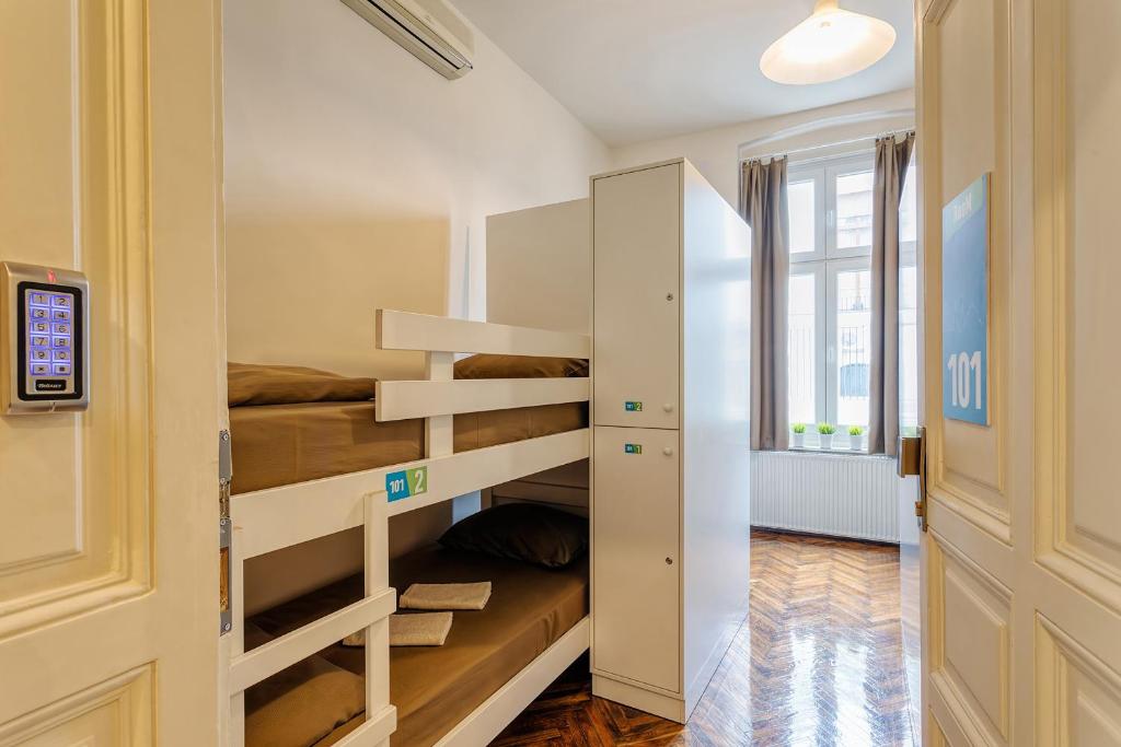 Postel nebo postele na pokoji v ubytování Booking BnB