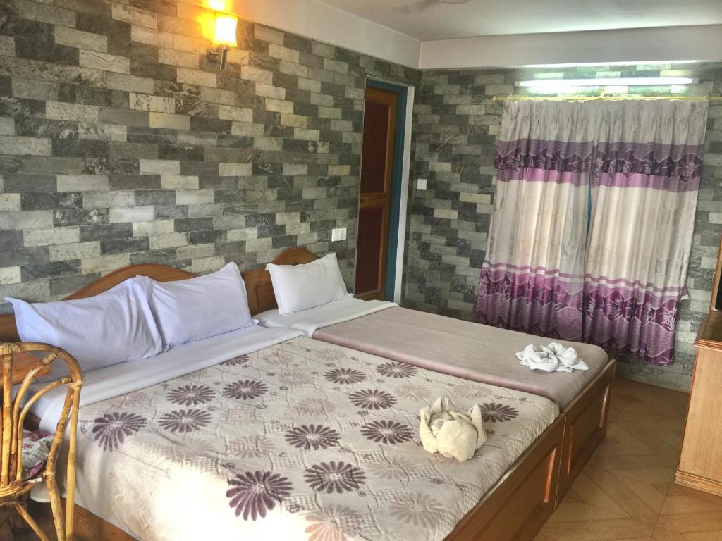 Letto o letti in una camera di Lake Vision Guesthouse