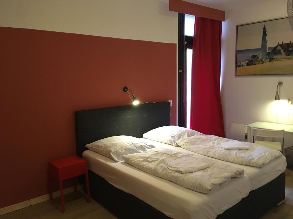 Postel nebo postele na pokoji v ubytování Gästehaus Kaiserpassage- Ihr Cityhostel