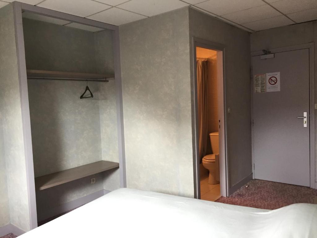 Postel nebo postele na pokoji v ubytování Hôtel Restaurant De La Mare