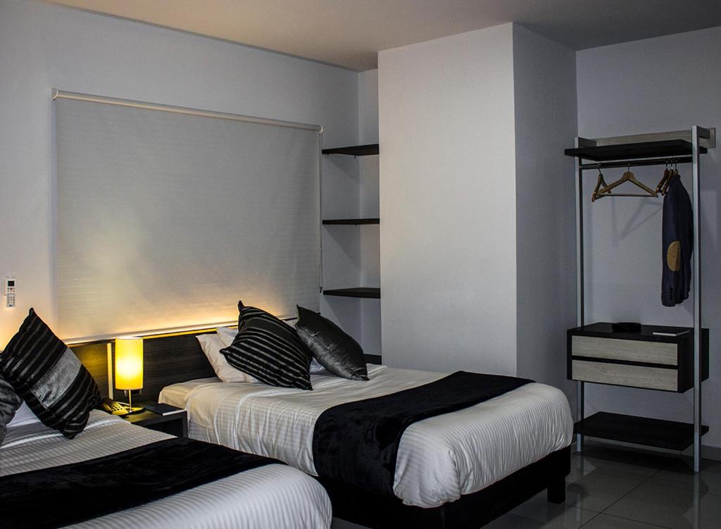 Postel nebo postele na pokoji v ubytování Hotel Doral Inn