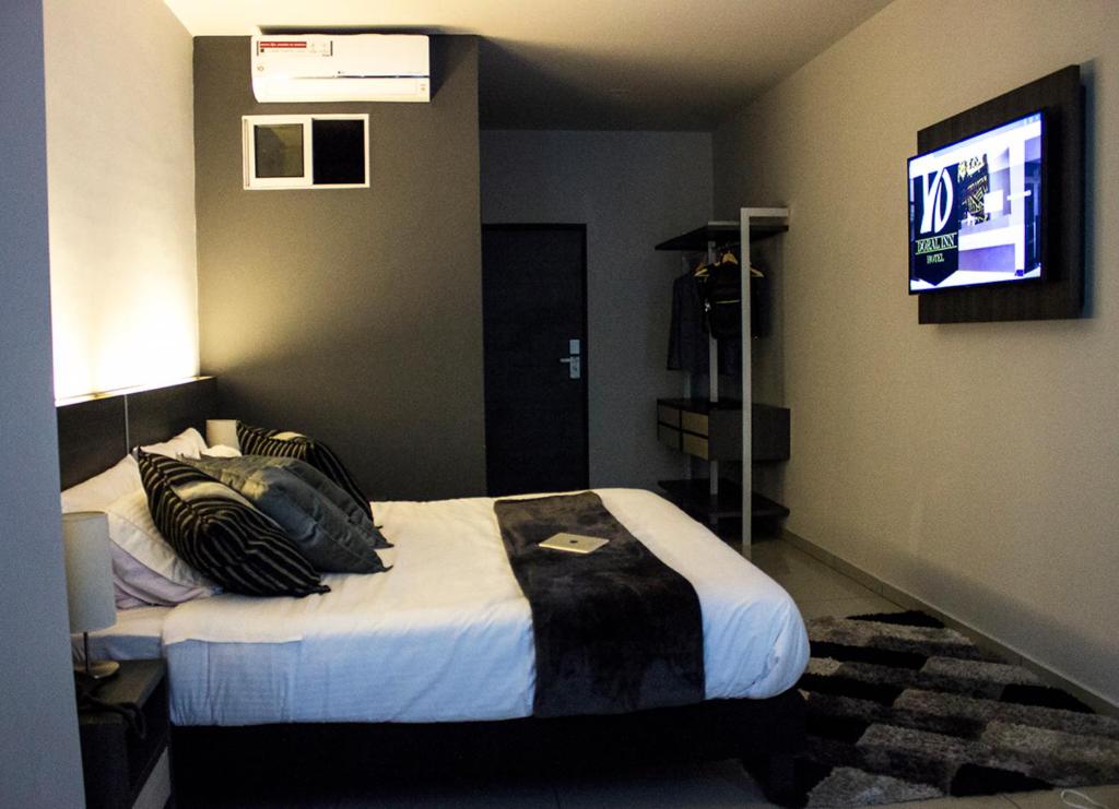 Postel nebo postele na pokoji v ubytování Hotel Doral Inn