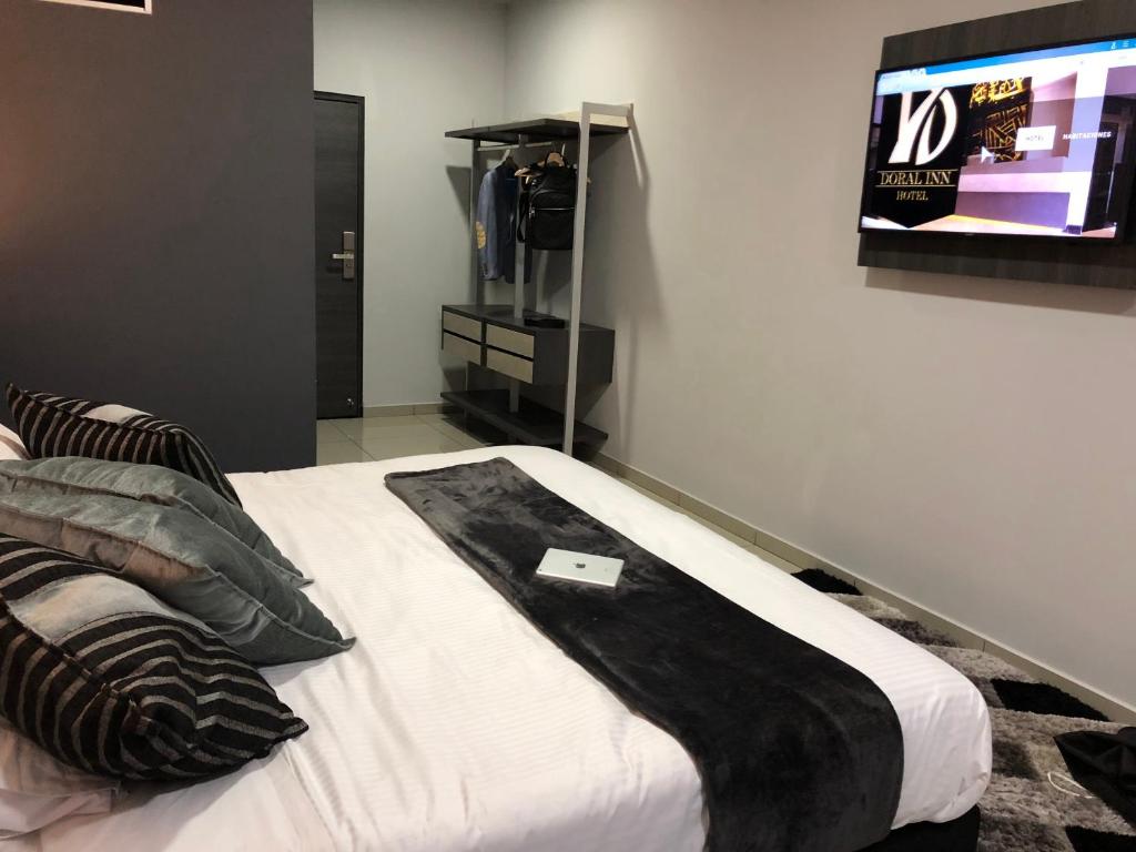Postel nebo postele na pokoji v ubytování Hotel Doral Inn