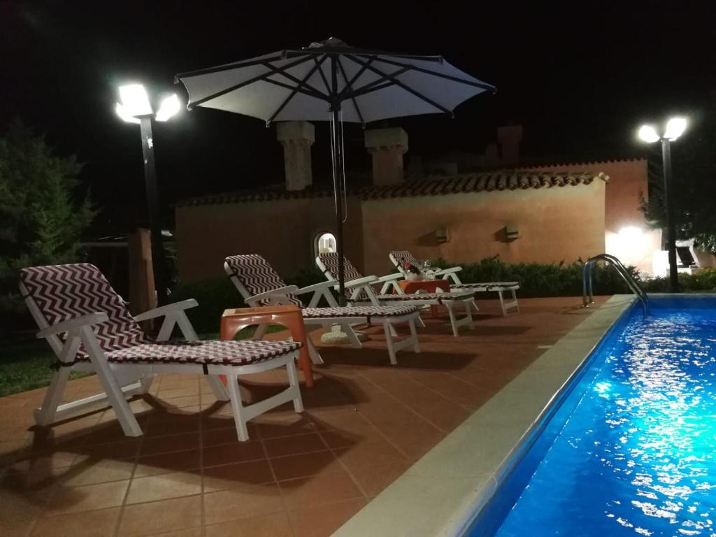 The swimming pool at or close to Villa con Piscina Stintino