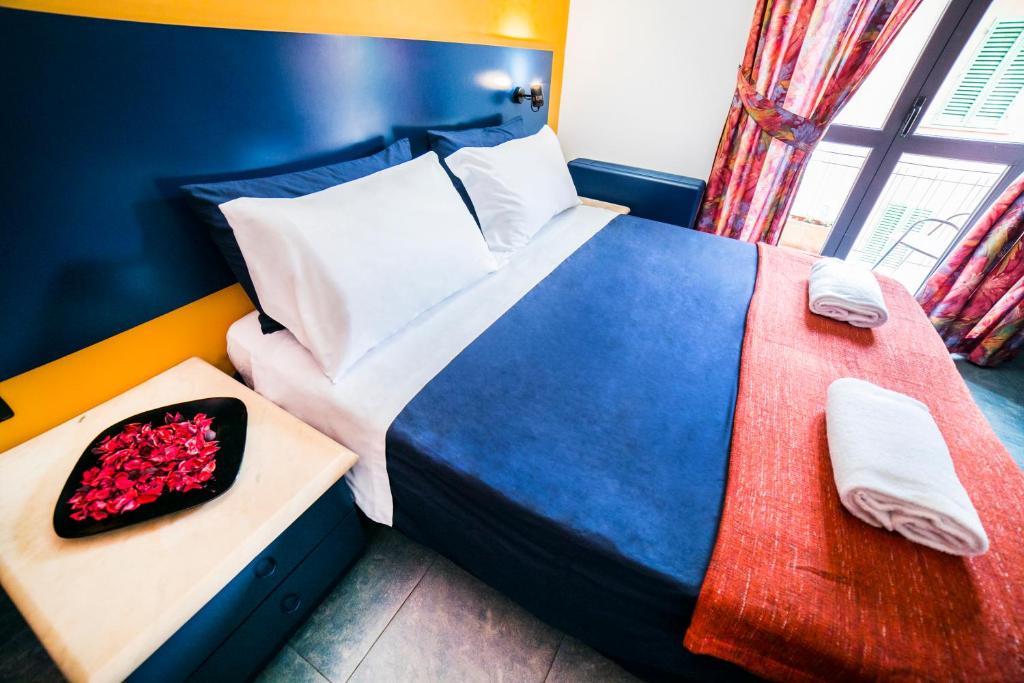 Postel nebo postele na pokoji v ubytování Hotel Raphael