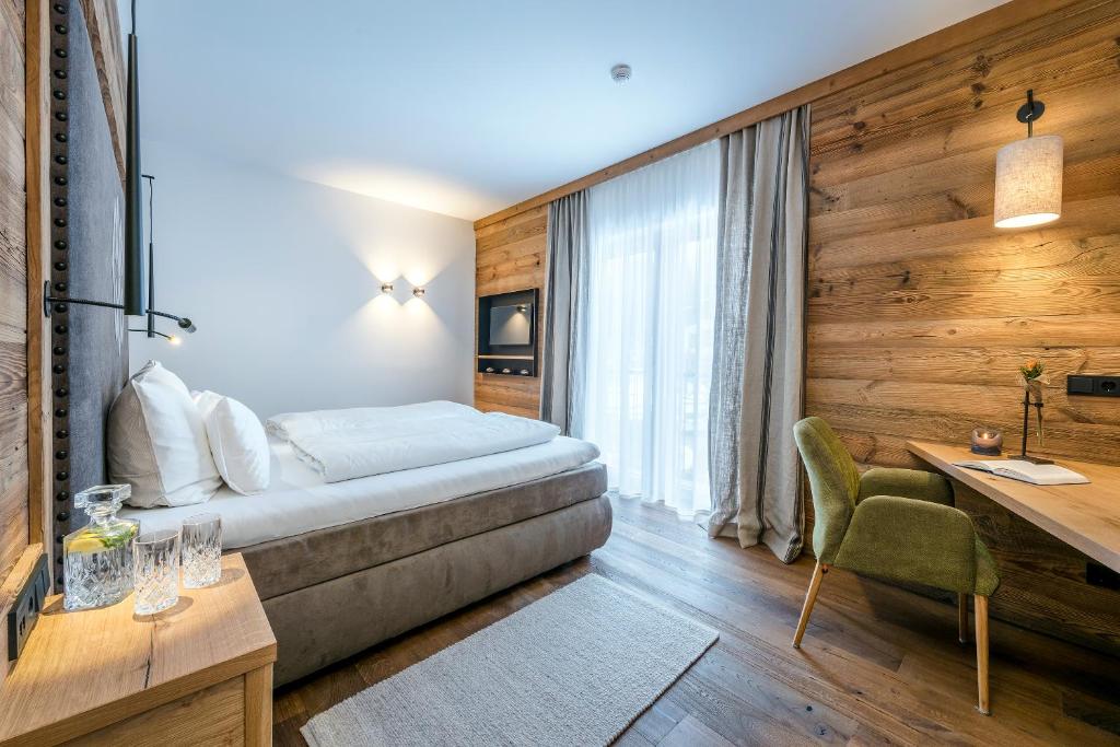 Postel nebo postele na pokoji v ubytování Kaiserlodge