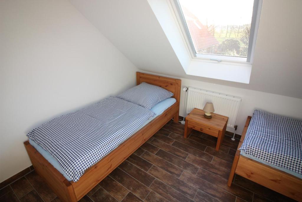 Postel nebo postele na pokoji v ubytování Lindenhof-Dangast