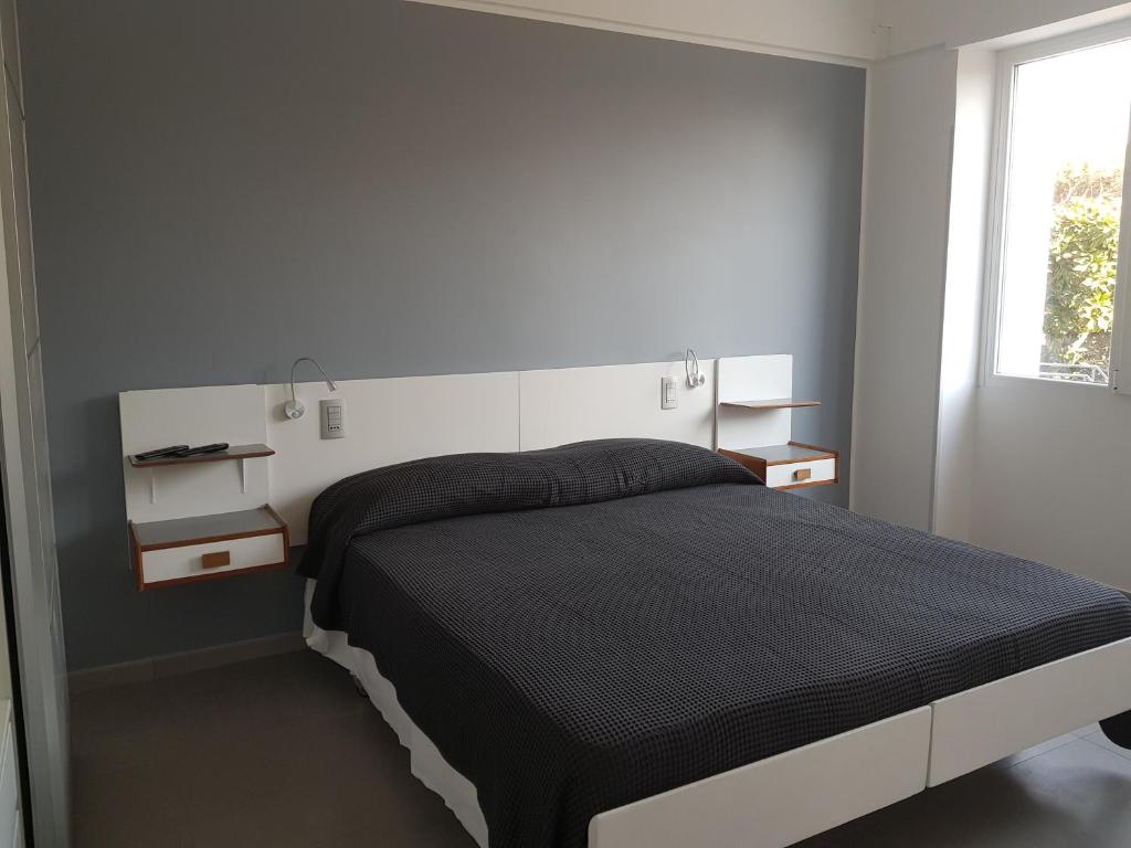 Postel nebo postele na pokoji v ubytování Golden Beach Residence