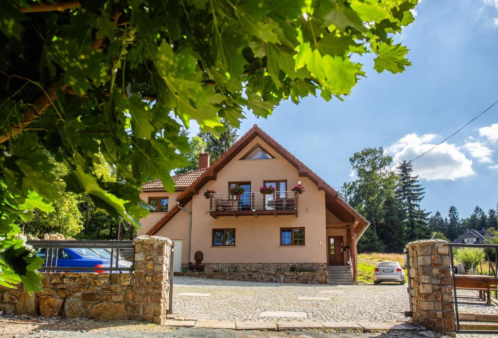 a house with a balcony in front of it at Willa Białka in Szklarska Poręba