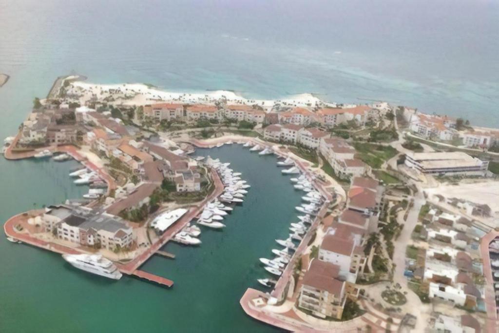 an aerial view of a harbor with boats in the water at Cap Cana Luxurious Marina Condo in Punta Cana