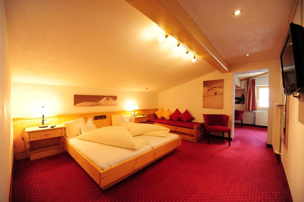 Postel nebo postele na pokoji v ubytování Hotel Toni