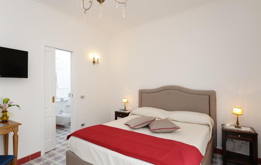 Postel nebo postele na pokoji v ubytování Residenza Luce