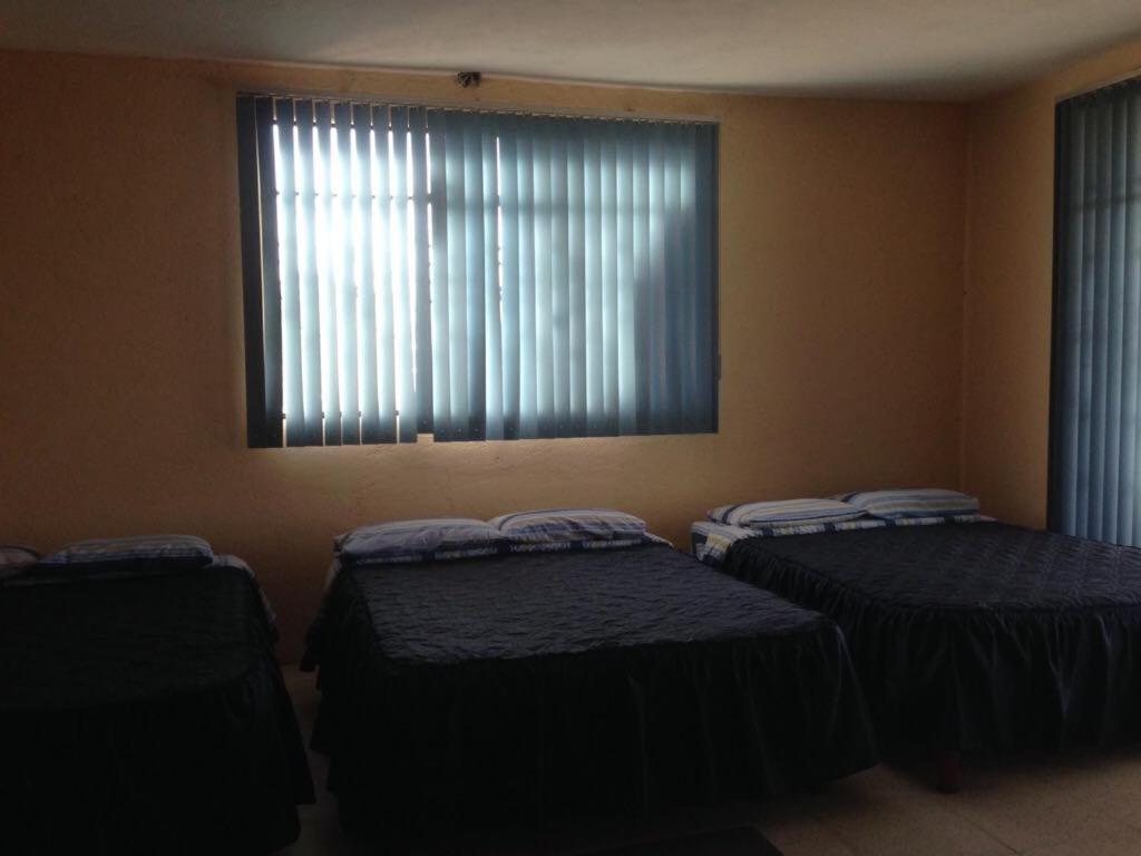 Postel nebo postele na pokoji v ubytování Hotel Lienzo Charro 1