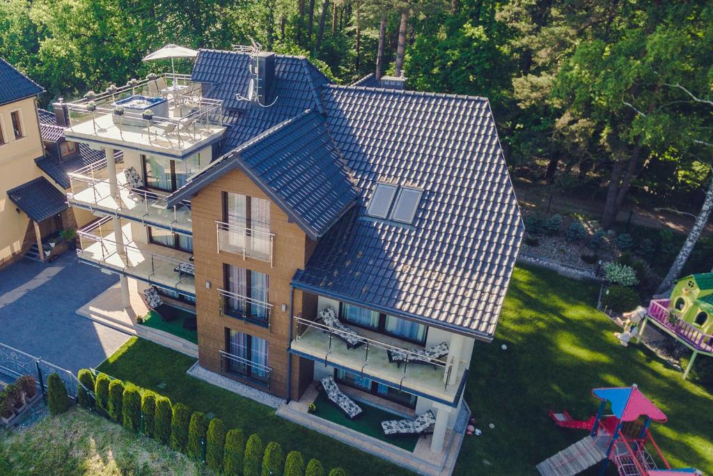 an overhead view of a house with a roof at Apartamenty Aparton in Ustka