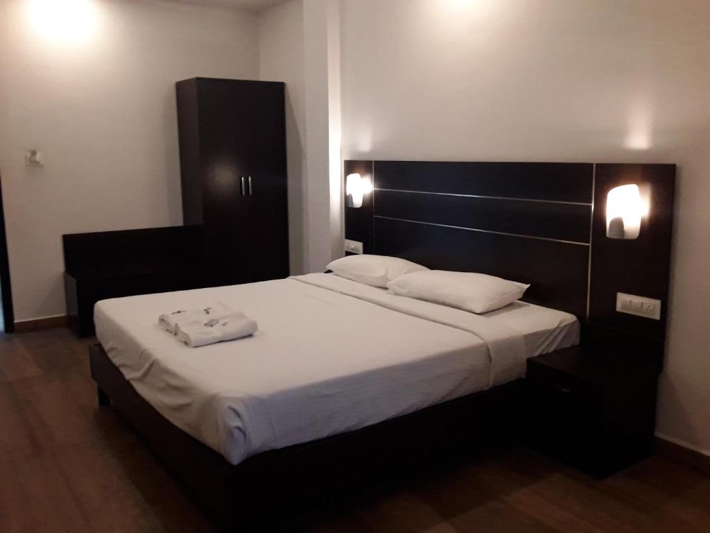 Postel nebo postele na pokoji v ubytování Jays Inn