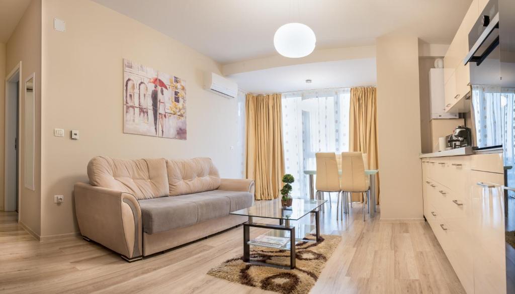 a living room with a couch and a table at Pavel's Apartment in Timişoara