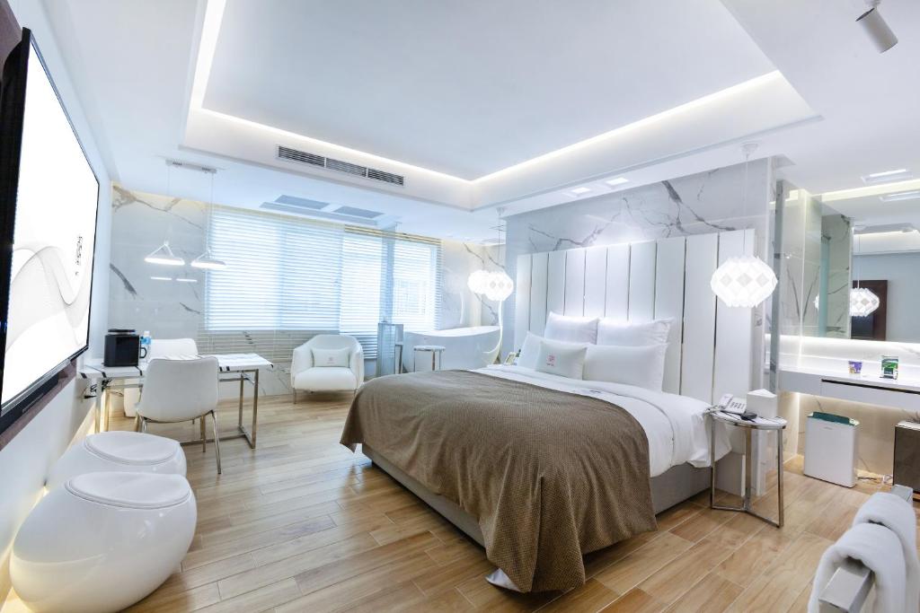 Postel nebo postele na pokoji v ubytování Chao Motel