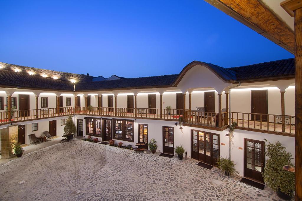 an exterior view of a building with a courtyard at HANI I PAZARIT Boutique Hotel in Korçë