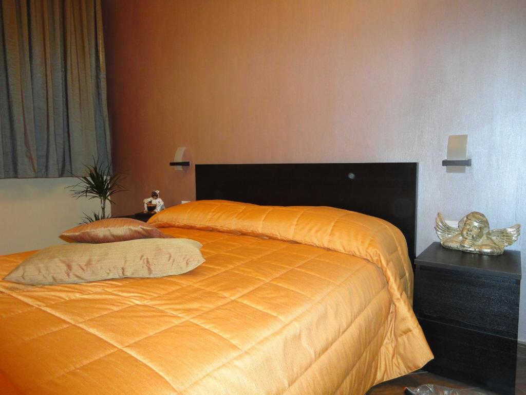 Posteľ alebo postele v izbe v ubytovaní B&B Il Campanile