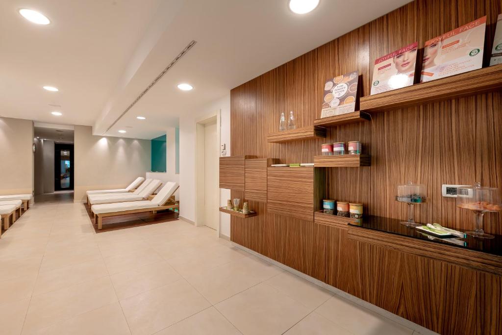 Postel nebo postele na pokoji v ubytování Hotel Baia Flaminia
