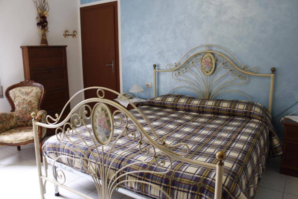 Postel nebo postele na pokoji v ubytování Albergo Elisa