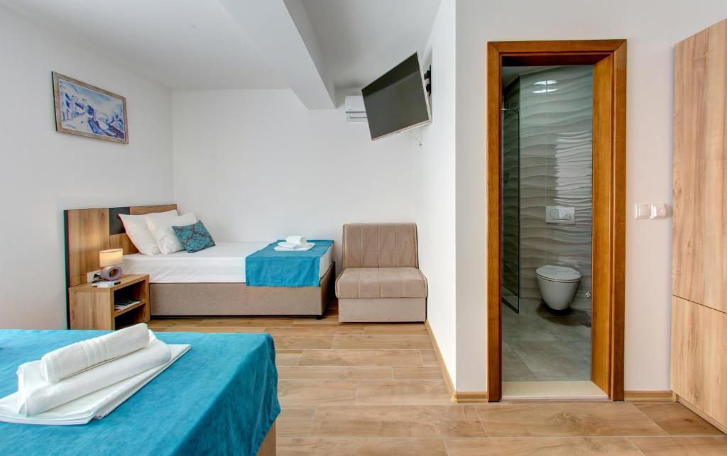 Postel nebo postele na pokoji v ubytování Villa Floris