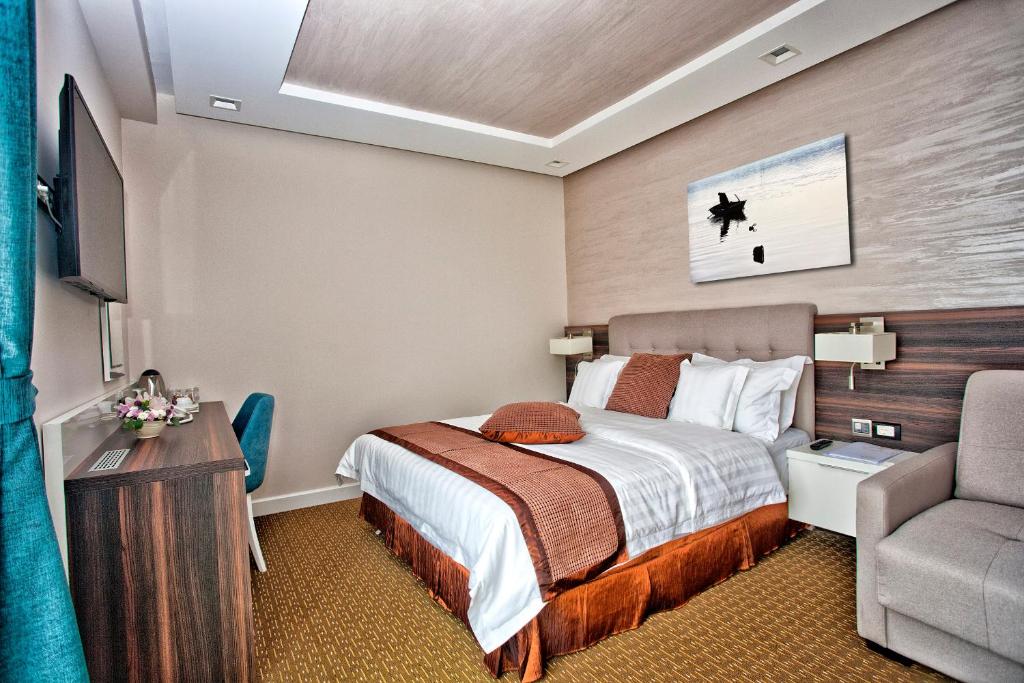 Postel nebo postele na pokoji v ubytování Wellness & Spa Hotel ACD
