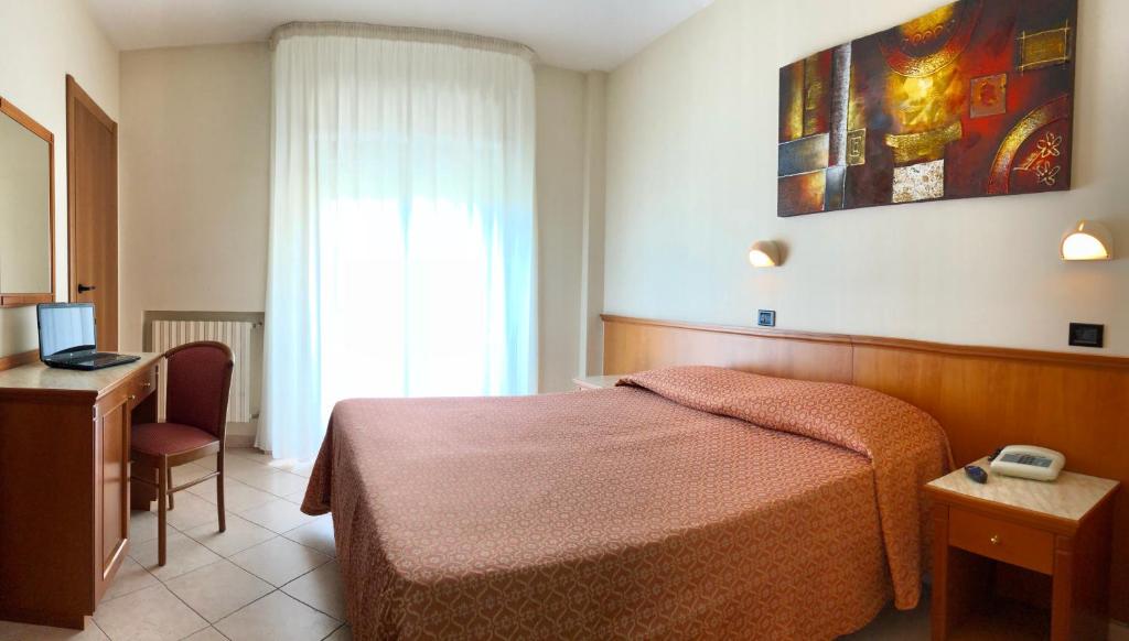 Postel nebo postele na pokoji v ubytování Hotel Sollievo - San Gennaro