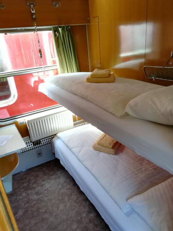 Postel nebo postele na pokoji v ubytování Wolkensteiner Zughotel