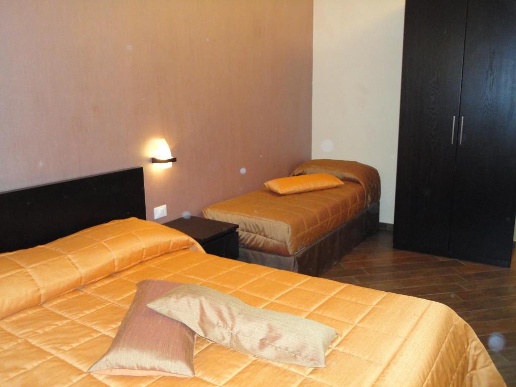 Posteľ alebo postele v izbe v ubytovaní B&B Il Campanile