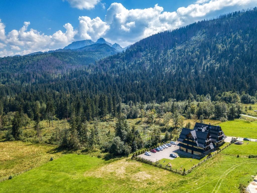 an aerial view of a house in the mountains at Hotel Eco Tatry Holiday& Spa in Kościelisko