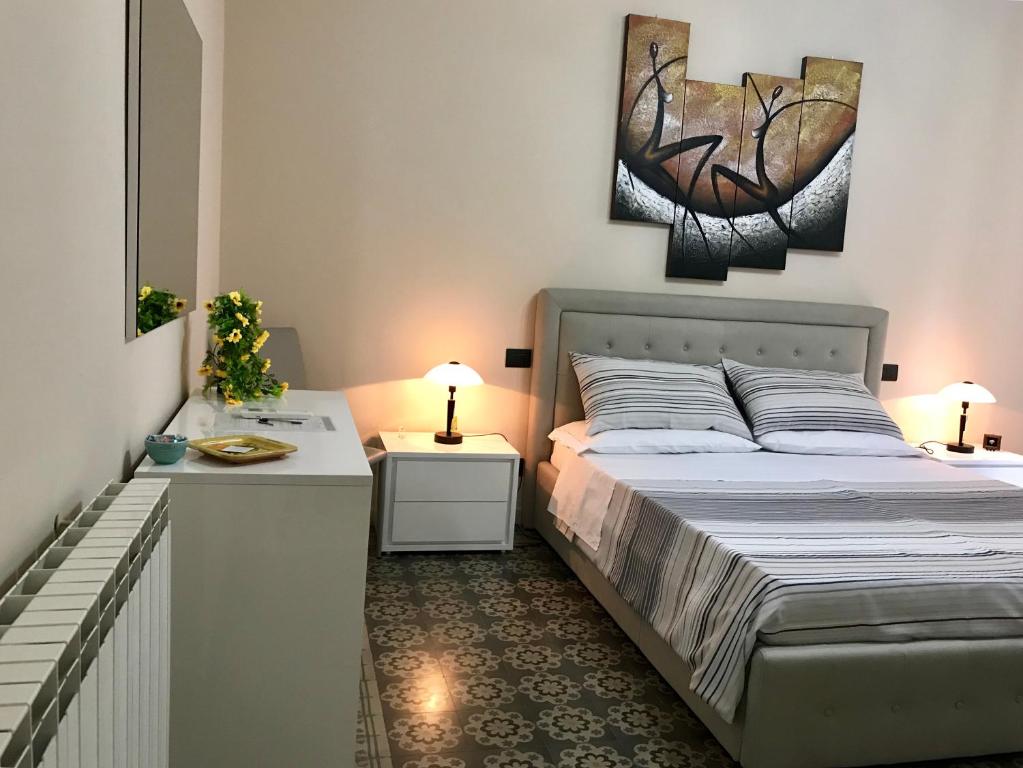 Łóżko lub łóżka w pokoju w obiekcie B&B Villa Roma
