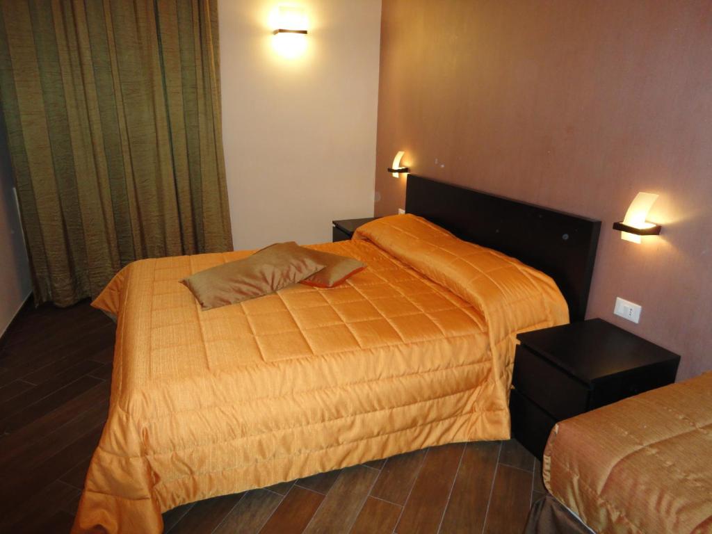 Posteľ alebo postele v izbe v ubytovaní B&B Il Campanile