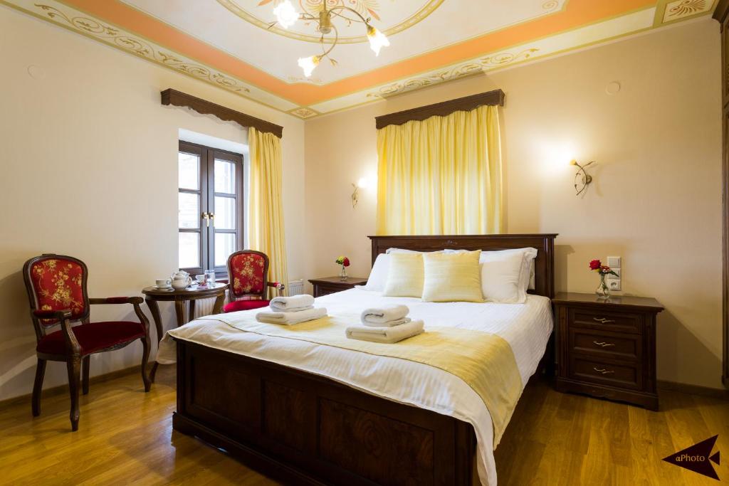 Postel nebo postele na pokoji v ubytování Villa Paroraia