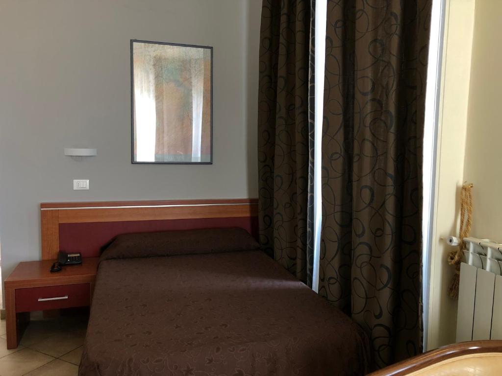 Postel nebo postele na pokoji v ubytování Hotel Brenta Milano