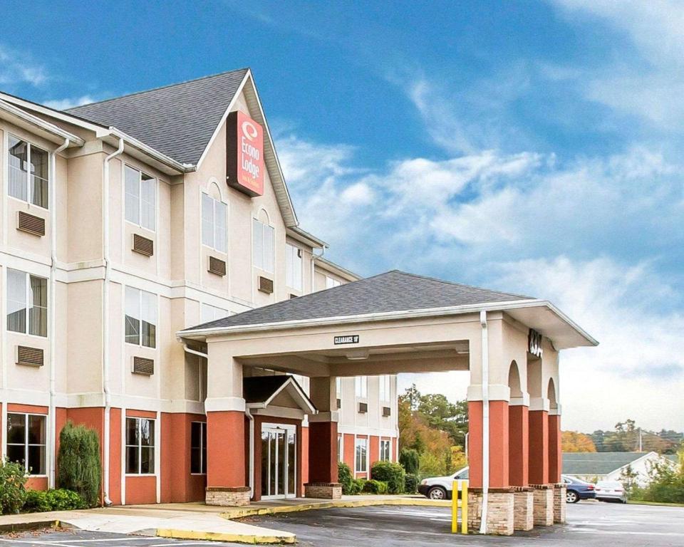 a hotel building with a sign on the front of it at Econo Lodge Inn & Suites in Douglasville