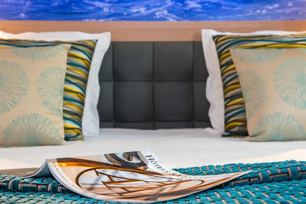 Cama ou camas em um quarto em Hotel Beau Rivage