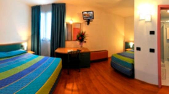 Postel nebo postele na pokoji v ubytování Hotel Vela