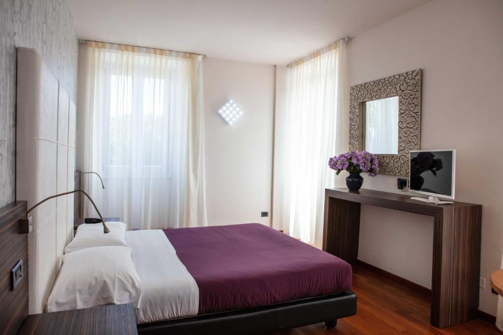 Postelja oz. postelje v sobi nastanitve Hotel Vittorio