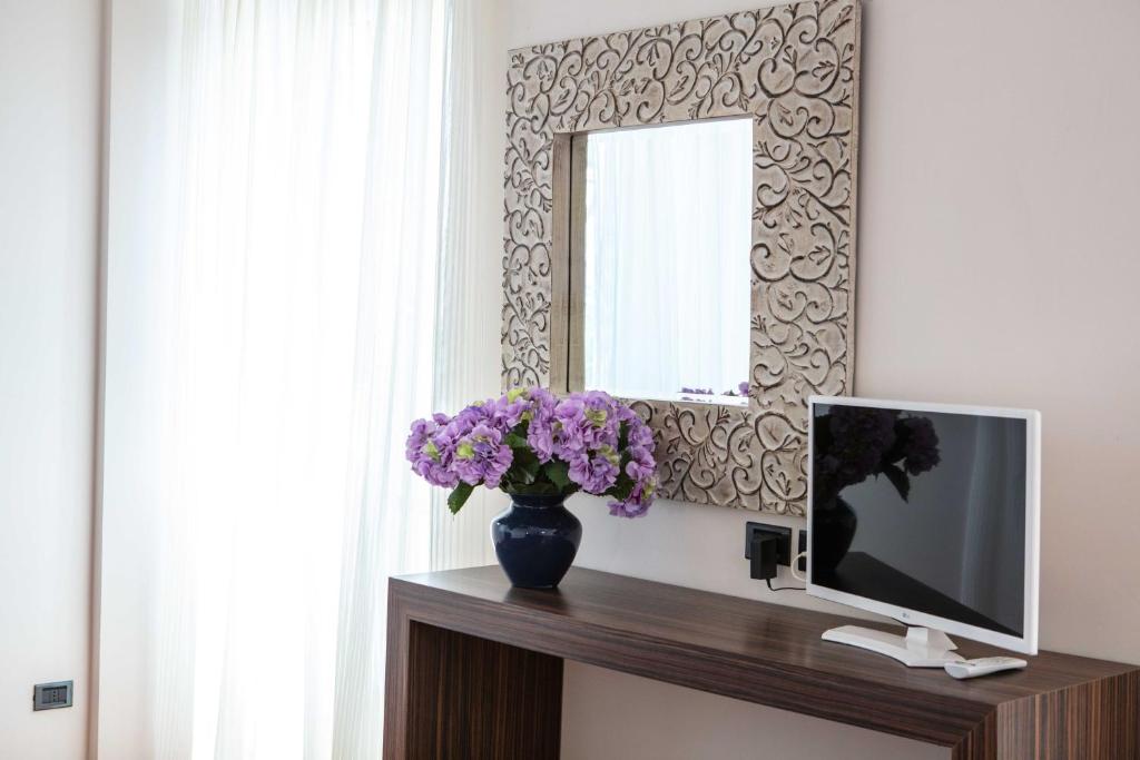 TV in/ali zabaviščno središče v nastanitvi Hotel Vittorio