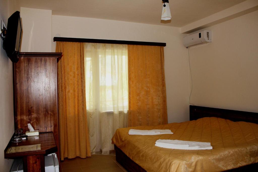Postel nebo postele na pokoji v ubytování Lucytour Hotel