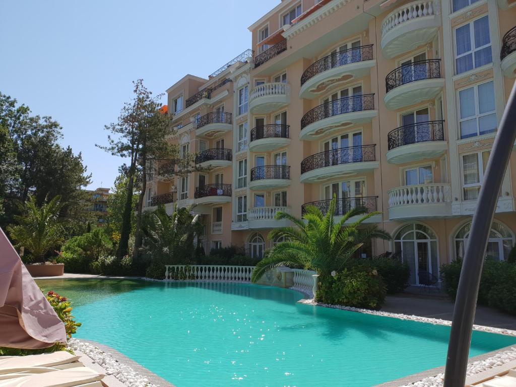 a swimming pool in front of a building at Apartments Anna on the Sunny beach in Sunny Beach