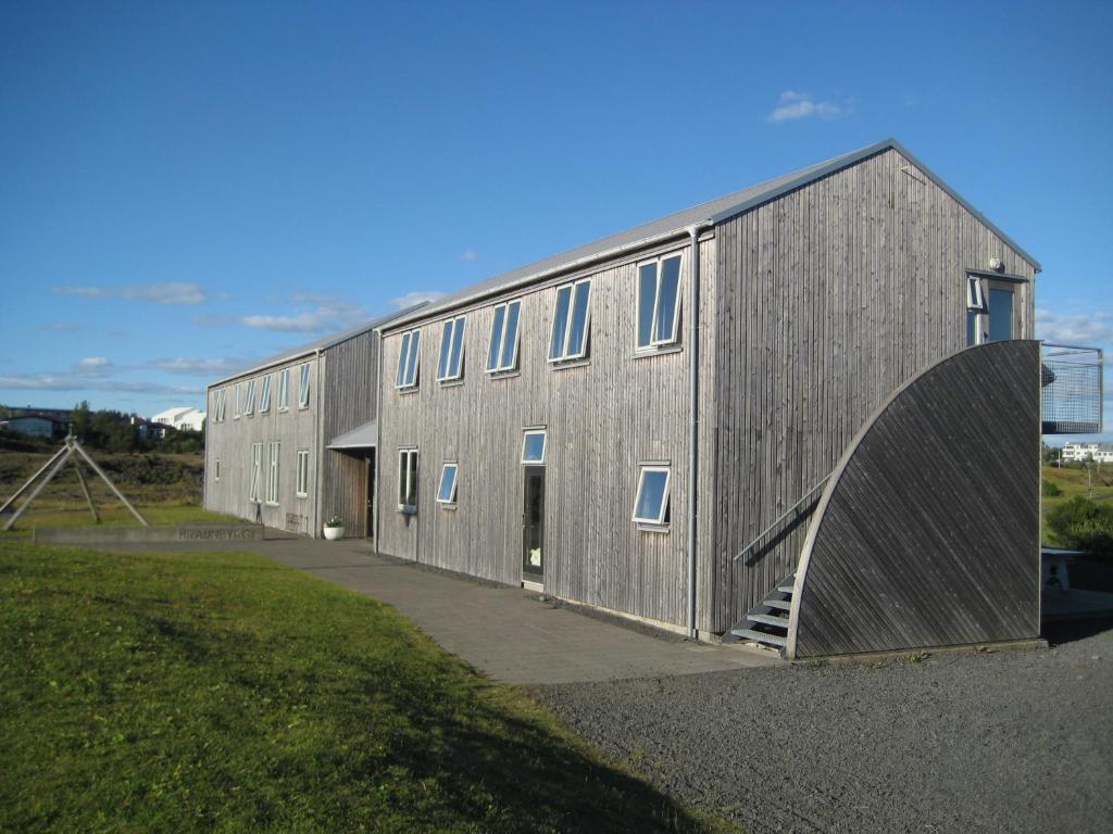 a large metal building with a ramp next to it at Lava Hostel in Hafnarfjörður