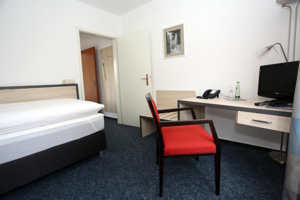 Postel nebo postele na pokoji v ubytování Hotel 7 Säulen GmbH
